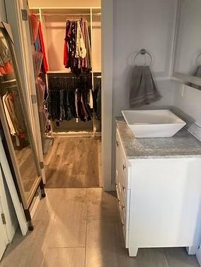 Primary bathroom after organizing — clean counters and cabinet by Kiera Rain, Bay Area Professional Organizer
