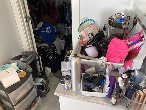 Primary bathroom before organizing — cluttered counters and cabinet, East Bay professional organizer Kiera Rain