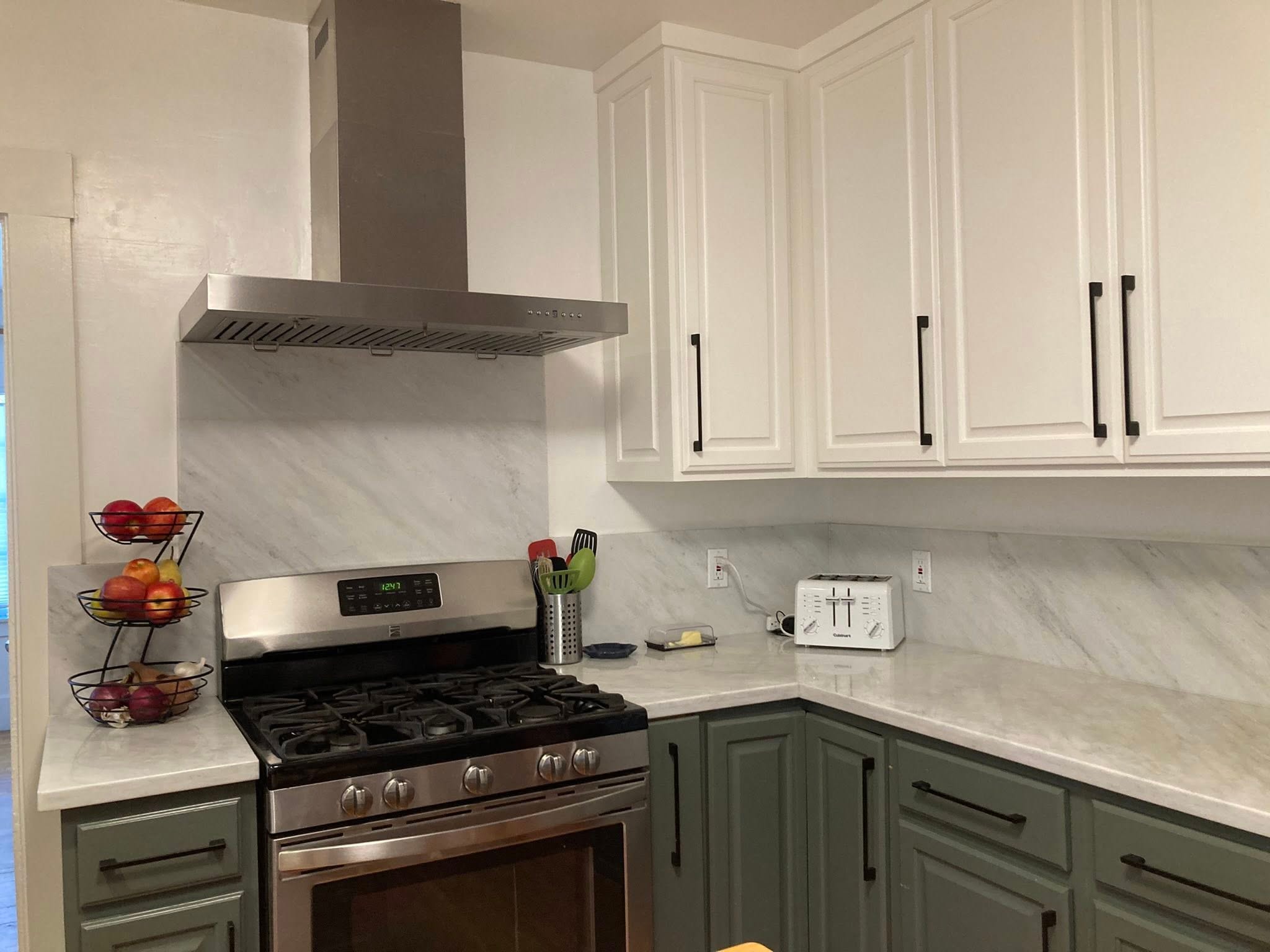 Modern kitchen with marble countertops organized by Kiera Rain, professional organizer serving Walnut Creek CA